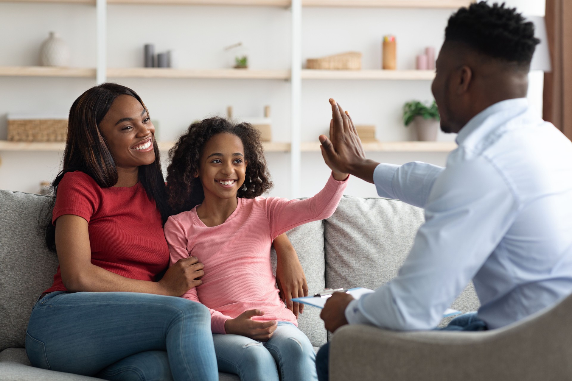 Black mother and daughter at the appointment with a psychologist