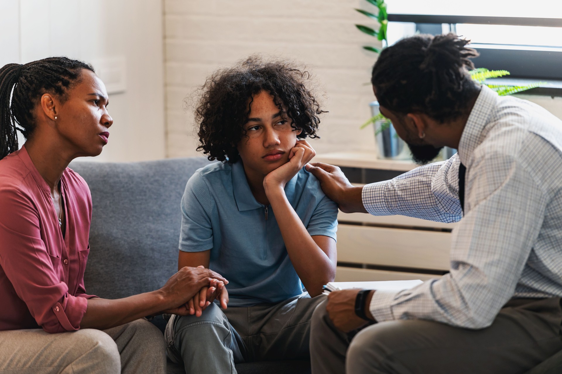 A woman with teen son has a meeting with a psychologist, a psychotherapist session