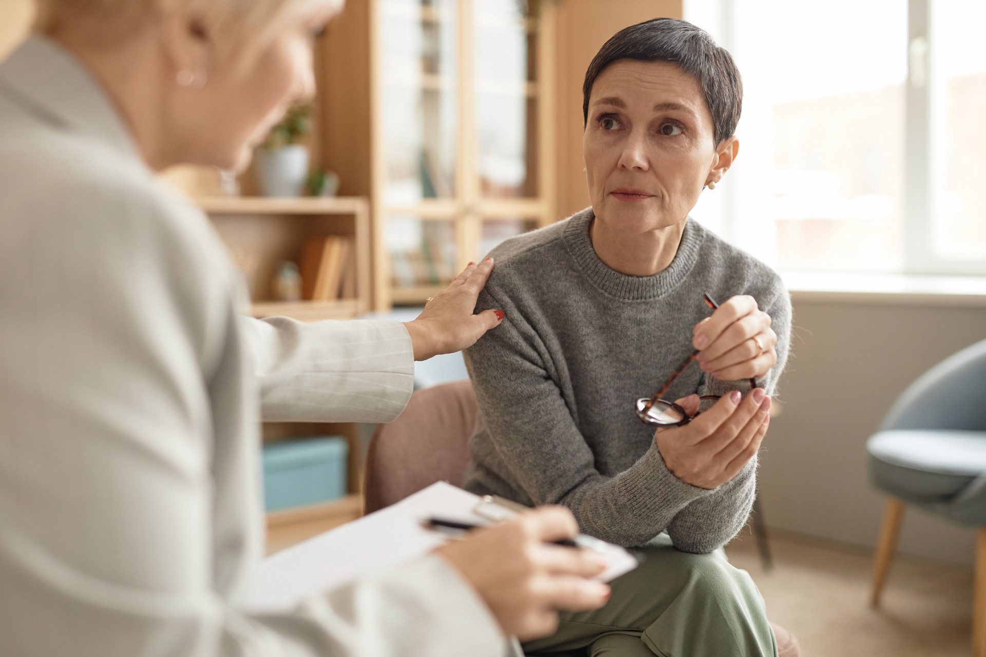 Distressed Mature Woman Listening to Female Psychologist